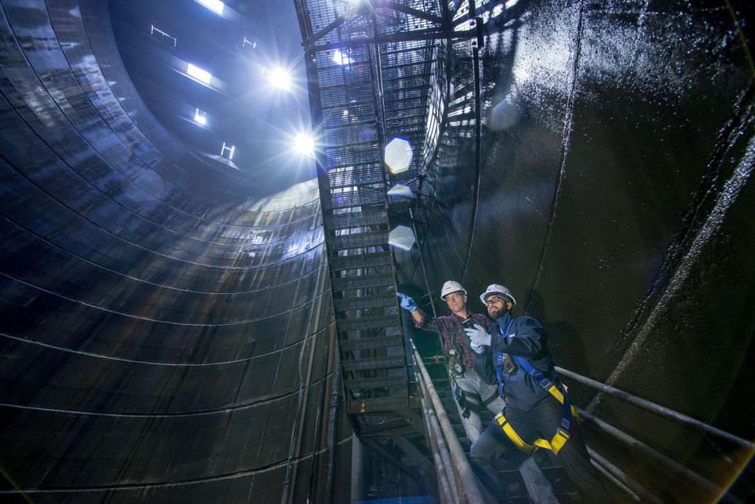Engineers inspect a deep underground shaft as part of large-scale civil construction projects Ontario.